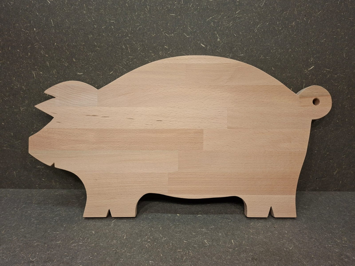 Handgefertigte Servierplatte und Vesperbrett in Schweinchenform aus massivem Buchenholz.