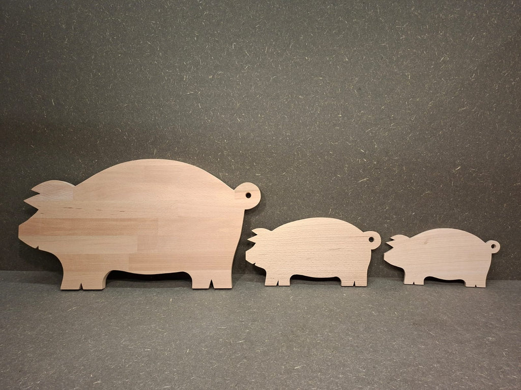 Handgefertigte Servierplatte und Vesperbrett in Schweinchenform aus massivem Buchenholz.