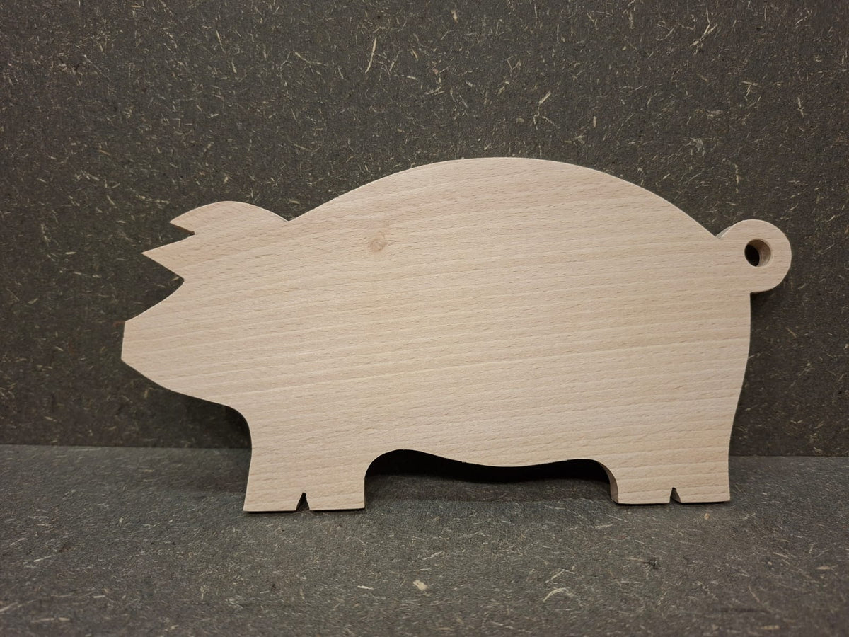 Handgefertigte Servierplatte und Vesperbrett in Schweinchenform aus massivem Buchenholz.