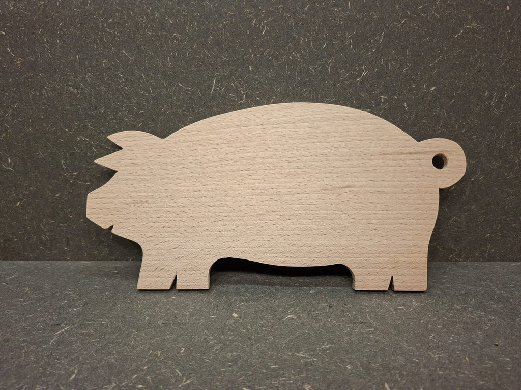 Handgefertigte Servierplatte und Vesperbrett in Schweinchenform aus massivem Buchenholz.